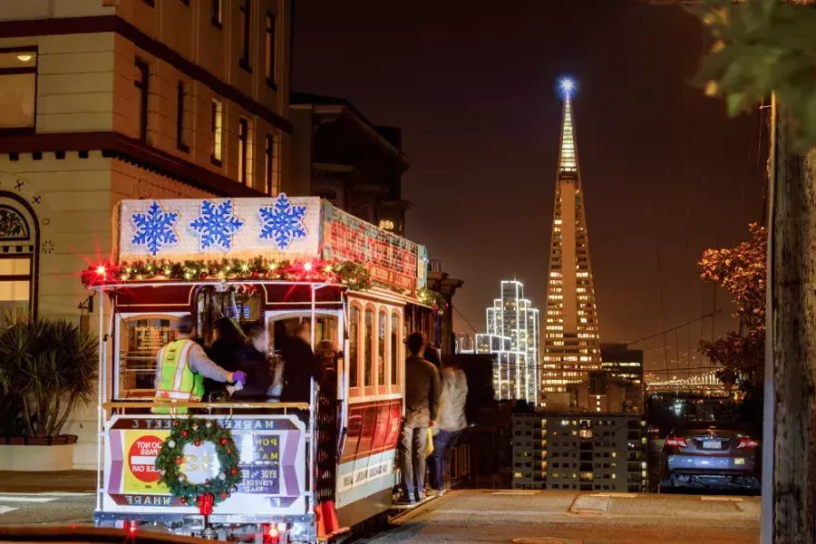 The cable cars are decorated for the holidays.